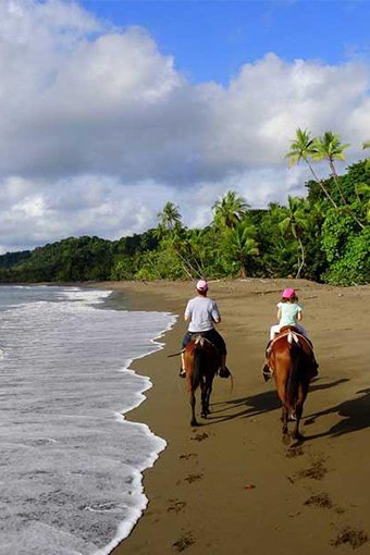 Adventurous horseback riding experience on the beach at Villas Azul Ballena.