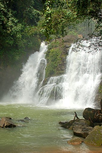 Refreshing waterfall cascading into a natural pool near Villas Azul Ballena.